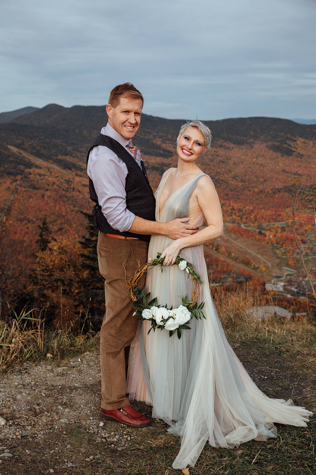  Bride in her rainbow dress and Groom during their Vermont elopement on Mt. Mansfield near Stowe 