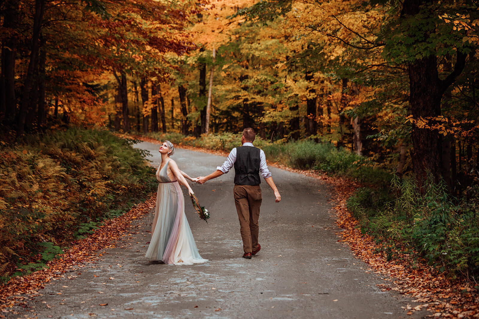  Couple enjoys colorful tree tunnel after their elopement in Stowe, Vermont on Mt. Mansfield 