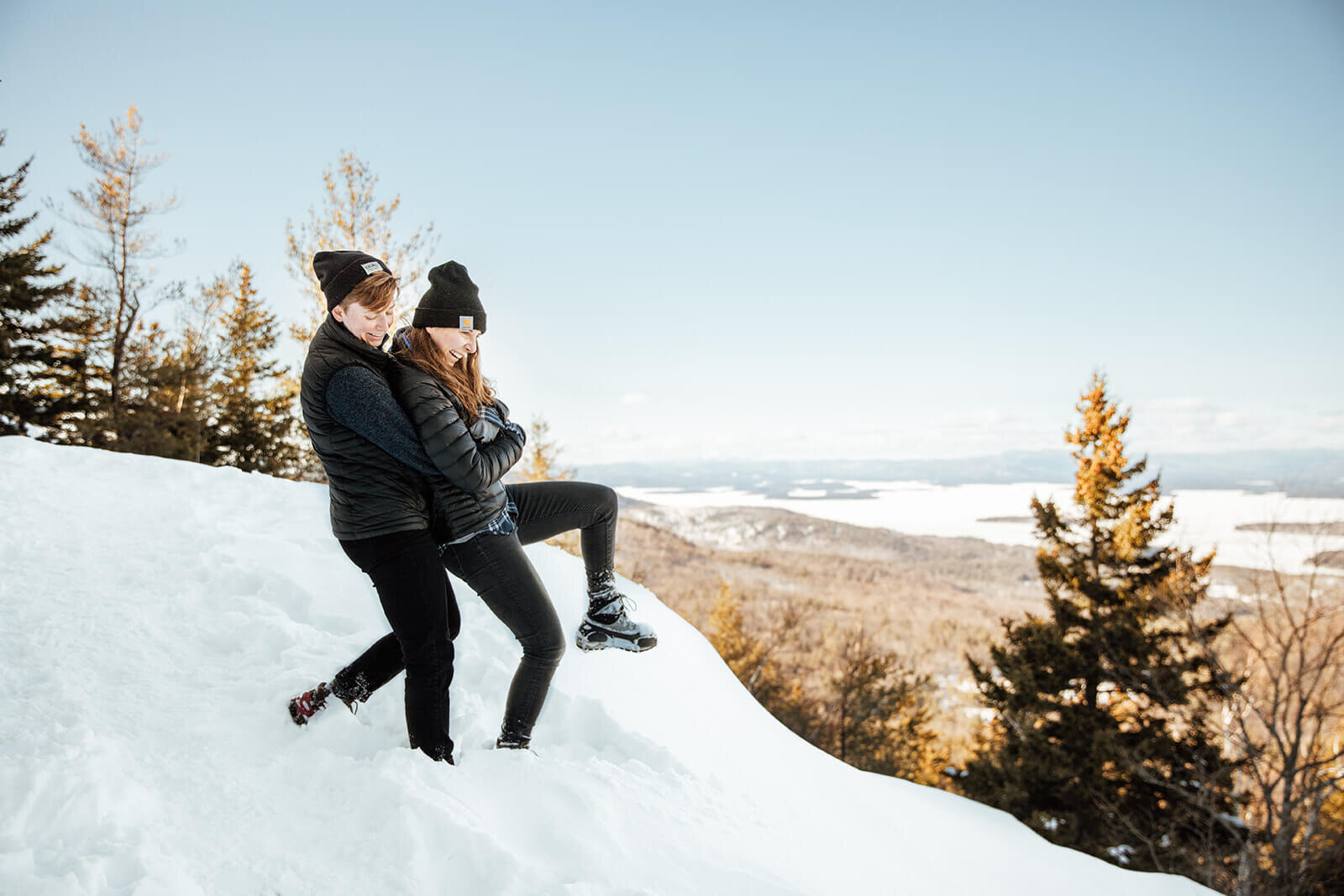  Couple hike Mt. Major in New Hampshire in the snow for their anniversary. New Hampshire elopement photographer 