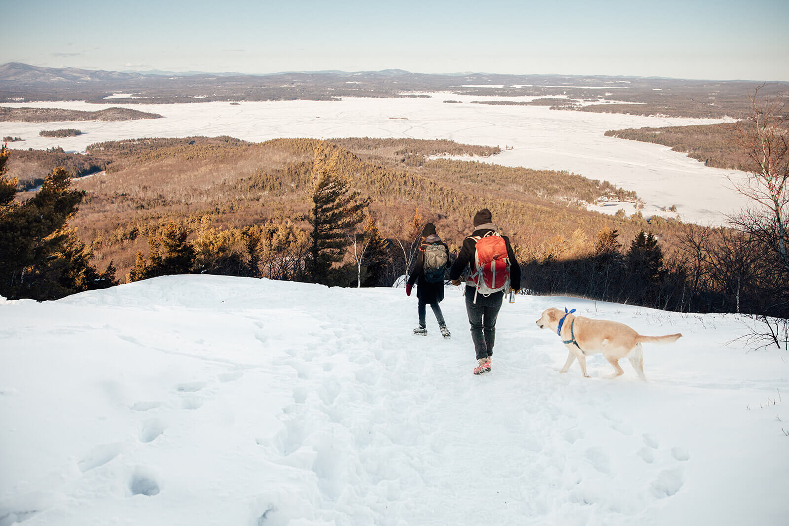  Couple hike on Mt. Major overlooking Lake Winnipesaukee in New Hampshire. New Hampshire elopement photographer  