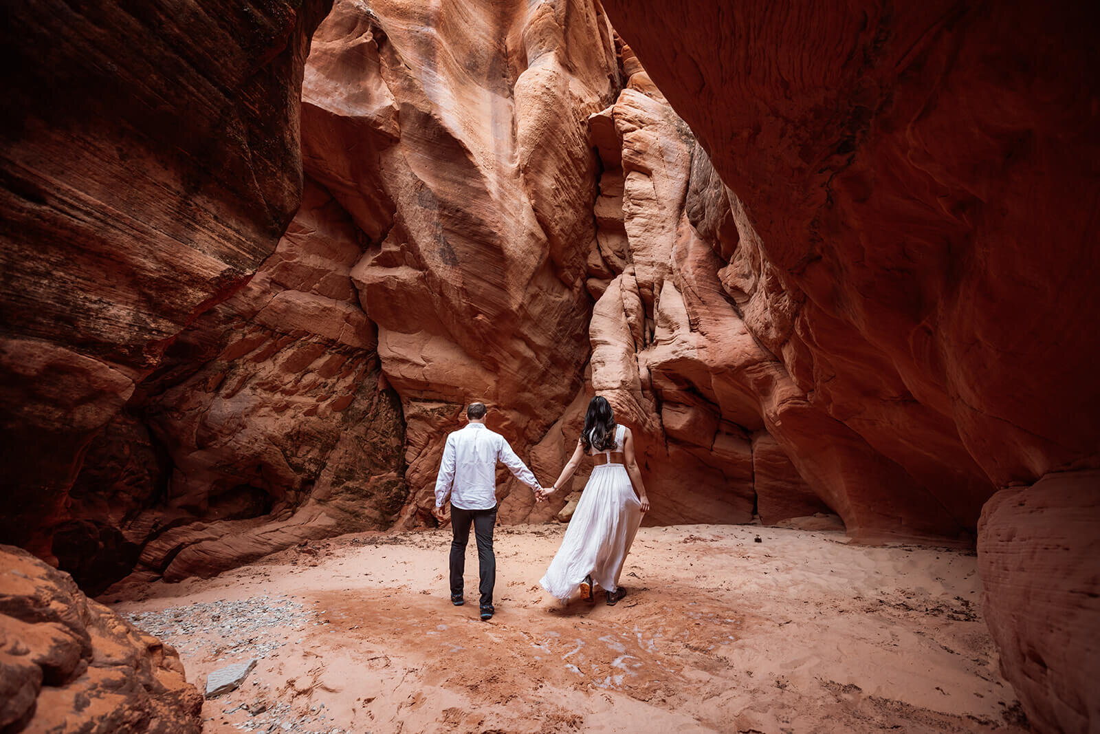  Eloping couple explore canyon outside of Zion National Park. Zion National Park elopement photographer 