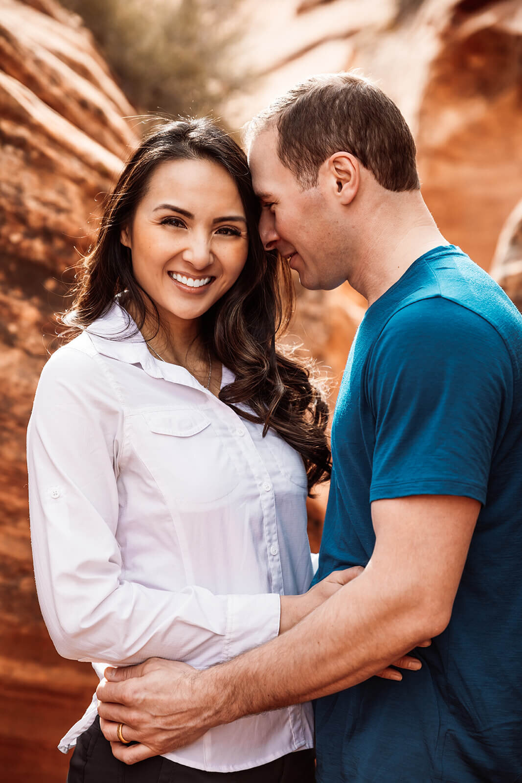  Eloping couple explore canyon outside of Zion National Park. Zion National Park engagement photographer 