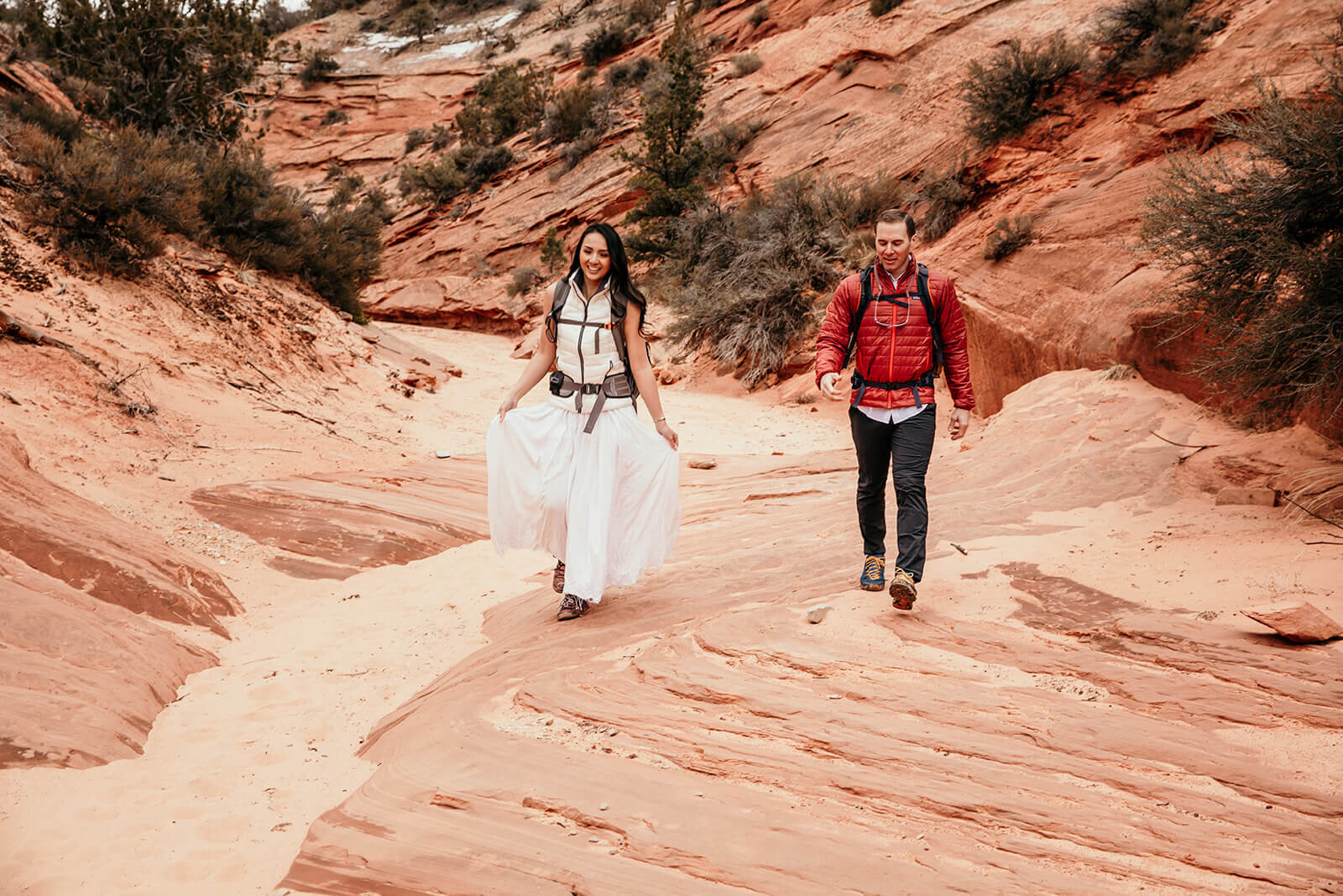 Eloping couple explore canyon outside of Zion National Park. Zion National Park elopement photographer 