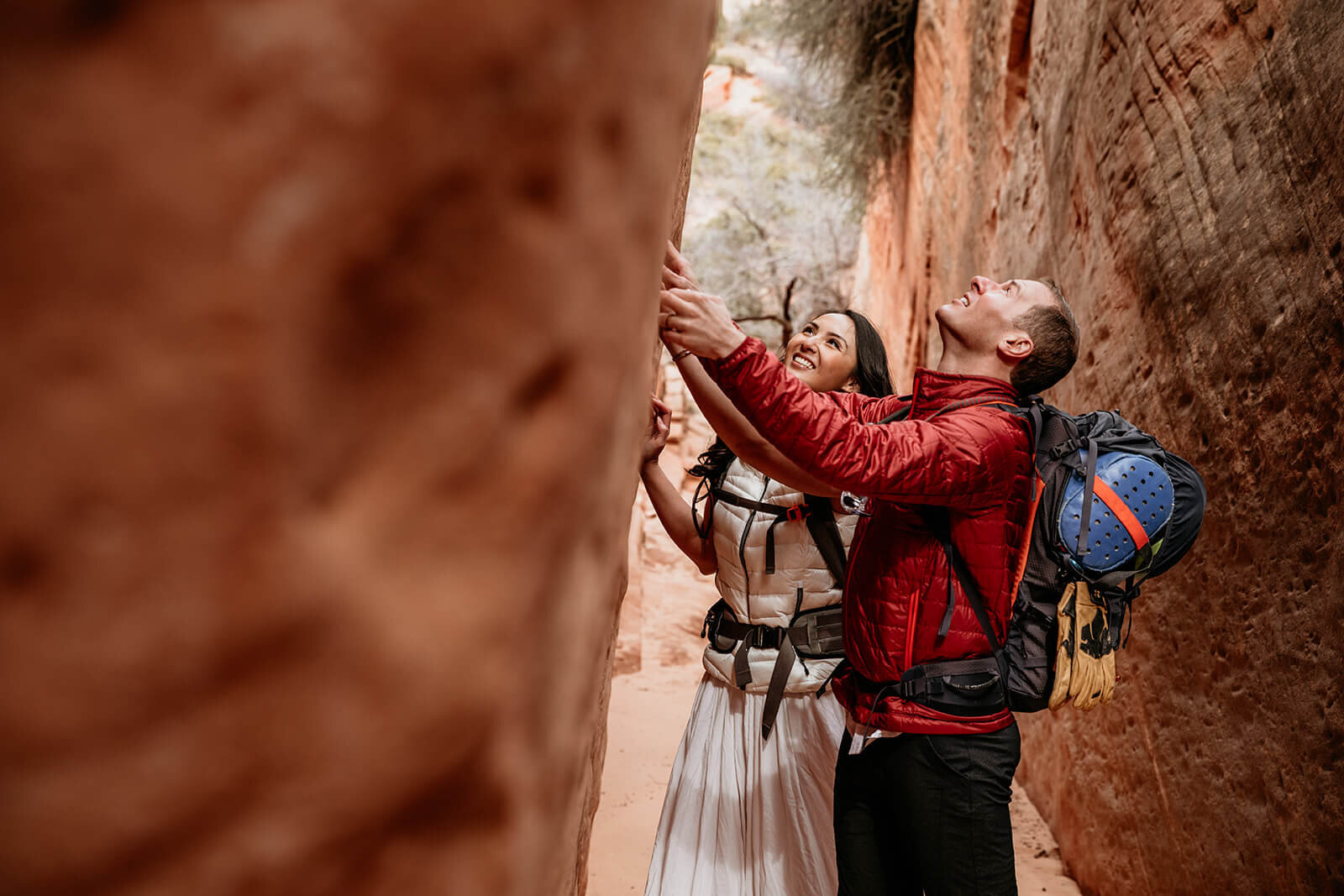  Eloping couple explore canyon outside of Zion National Park. Zion National Park elopement photographer 