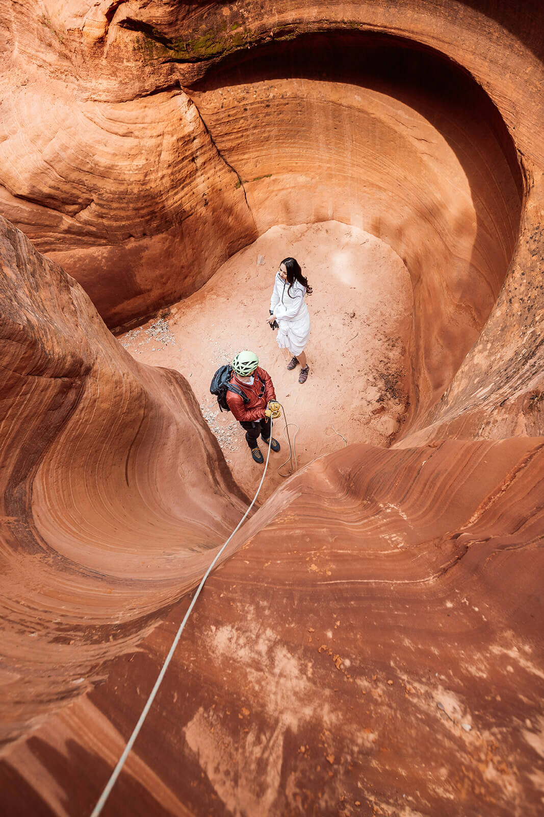  Eloping couple explore and rappel in a technical canyon outside of Zion National Park. Zion National Park elopement photographer 