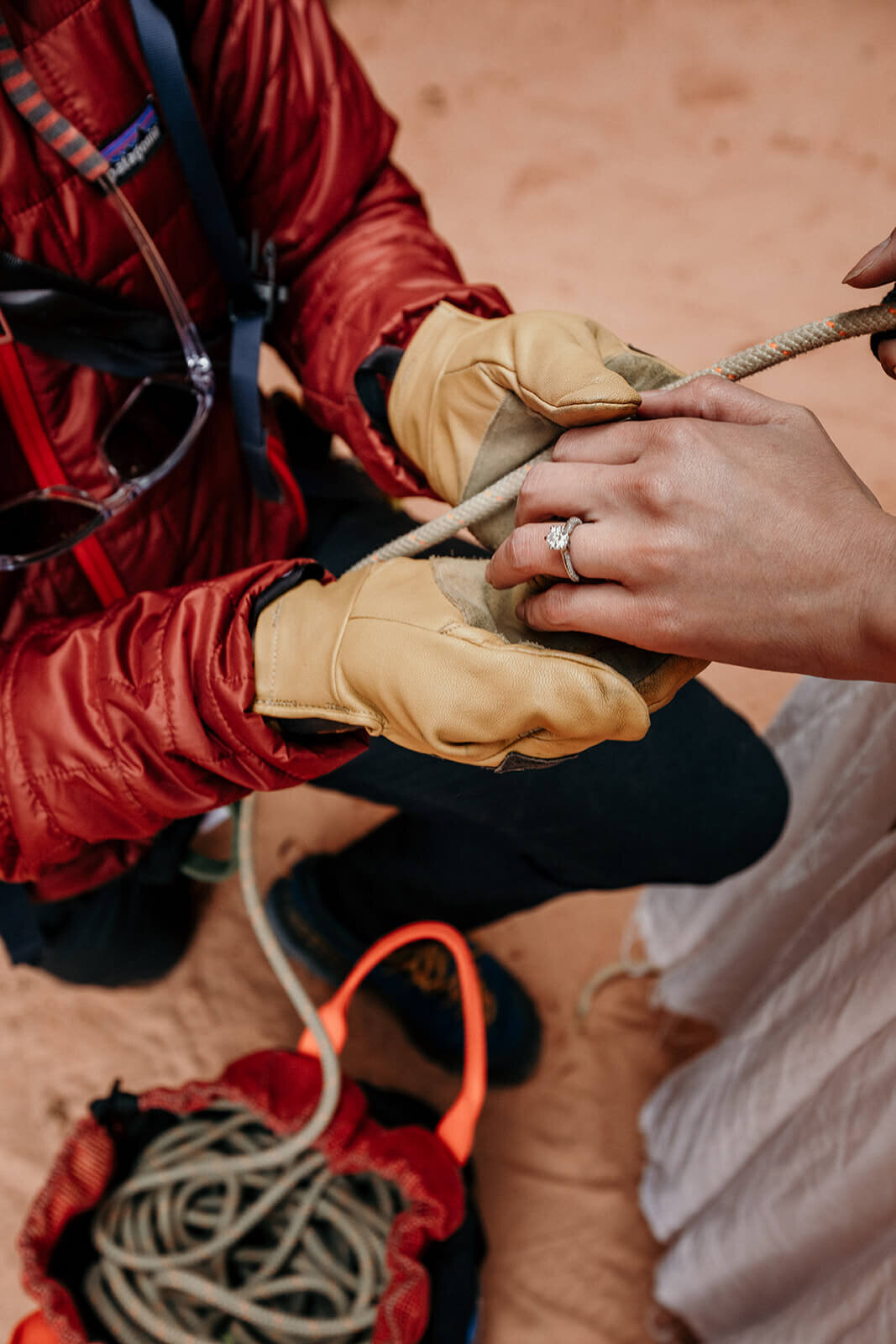  Man proposes to woman on rappel in a technical canyon outside of Zion National Park. Zion National Park elopement photographer 