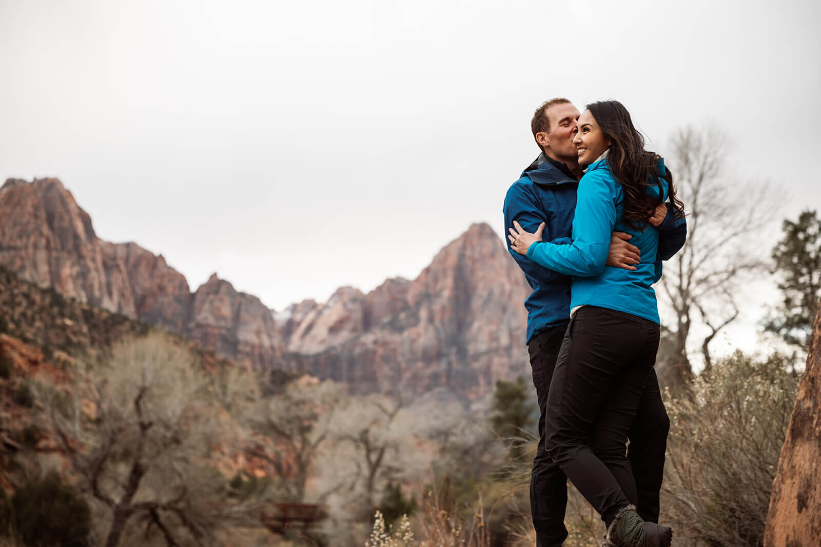 Engaged couple explore Zion National Park. Zion National Park elopement photographer 