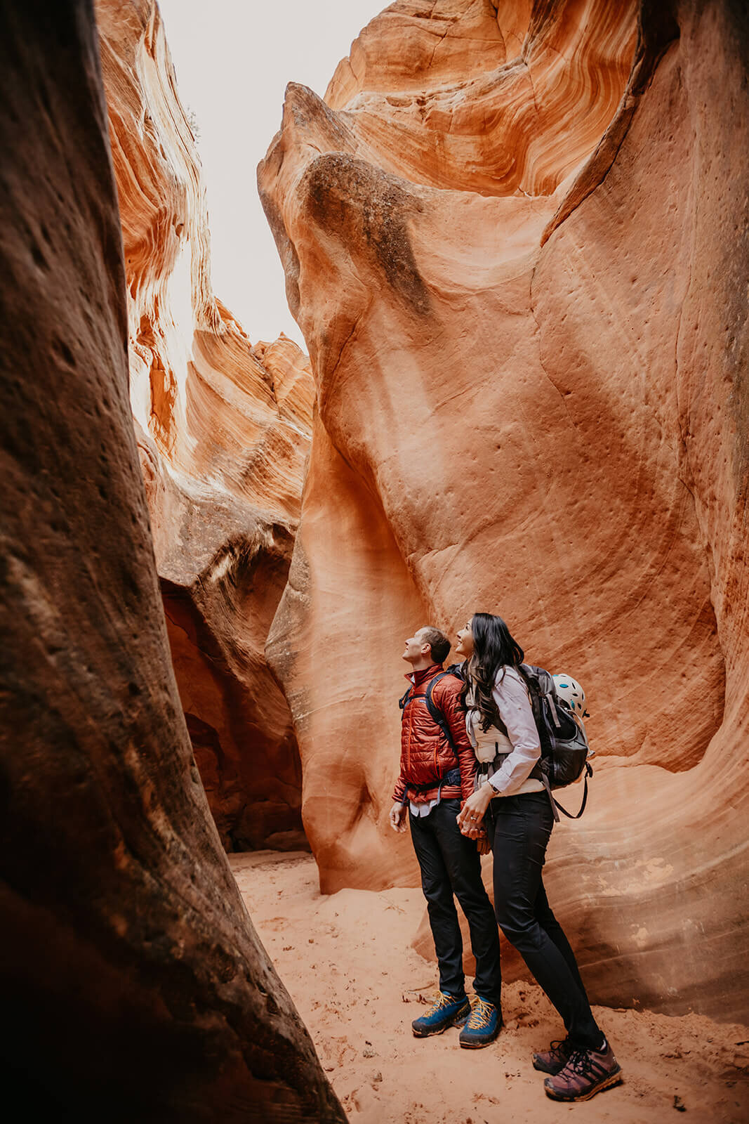  Eloping couple explore a technical canyon outside of Zion National Park. Zion National Park couples photographer 