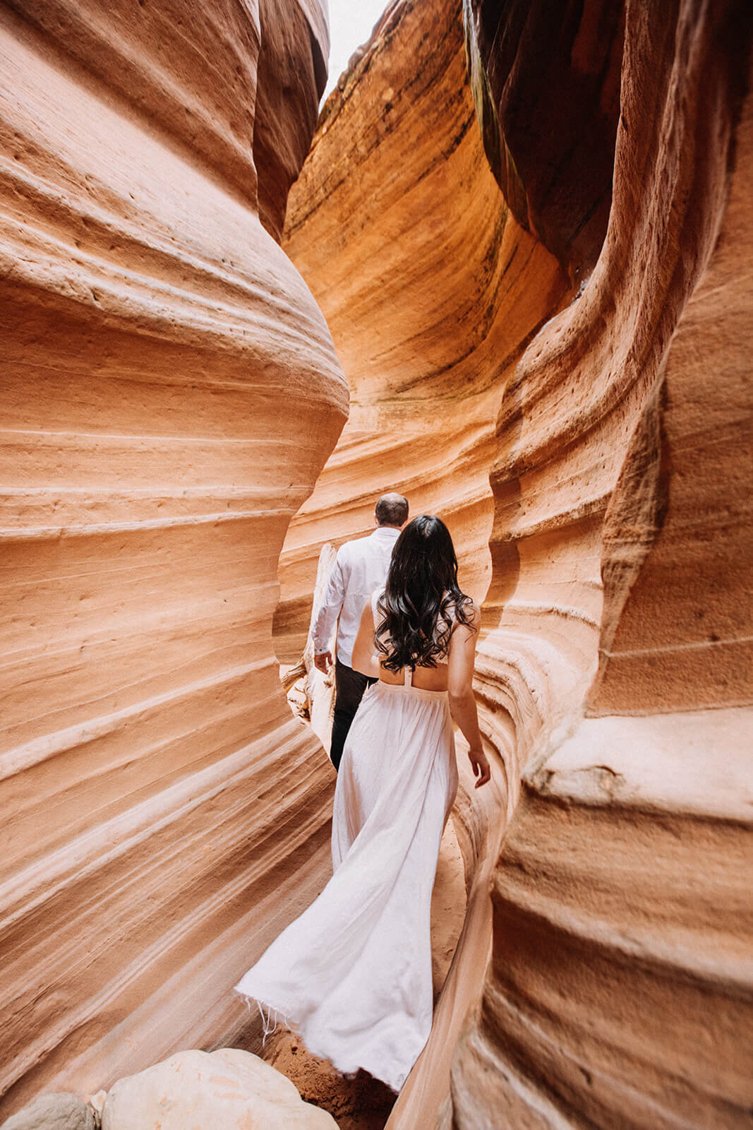  Eloping couple explore a technical canyon outside of Zion National Park. Zion National Park, Utah elopement photographer 