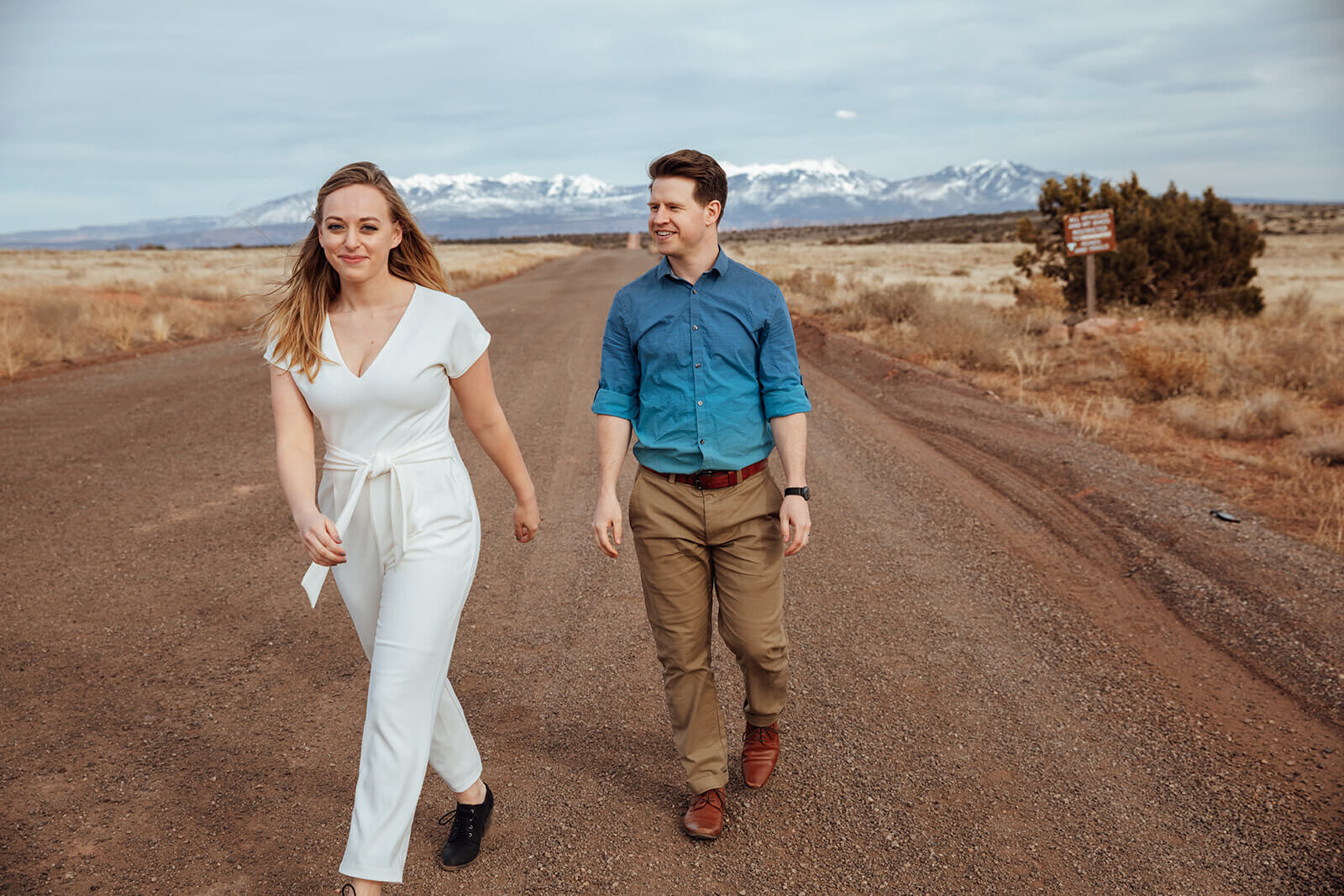  Couple celebrates anniversary at Dead Horse Point State Park and the La Sal Mountains near Moab, Utah with incredible views and hiking. Utah anniversary photographer 