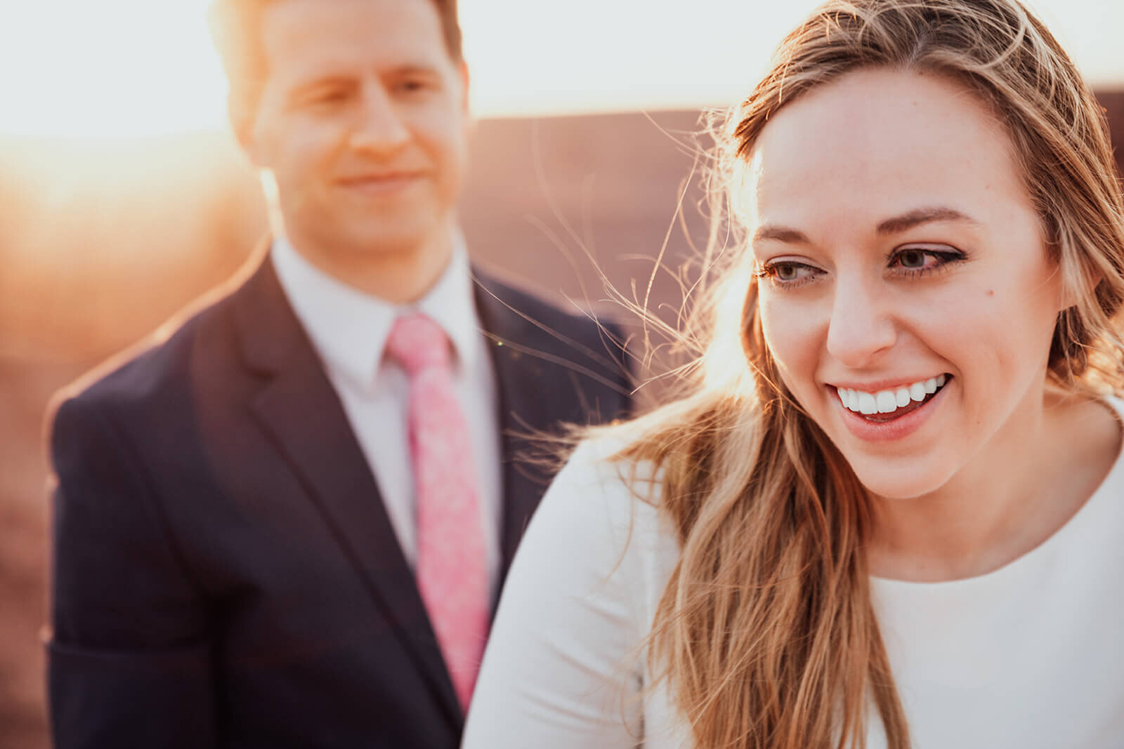  Bride laughs during sunset with groom at Dead Horse Point State Park near Moab, Utah 