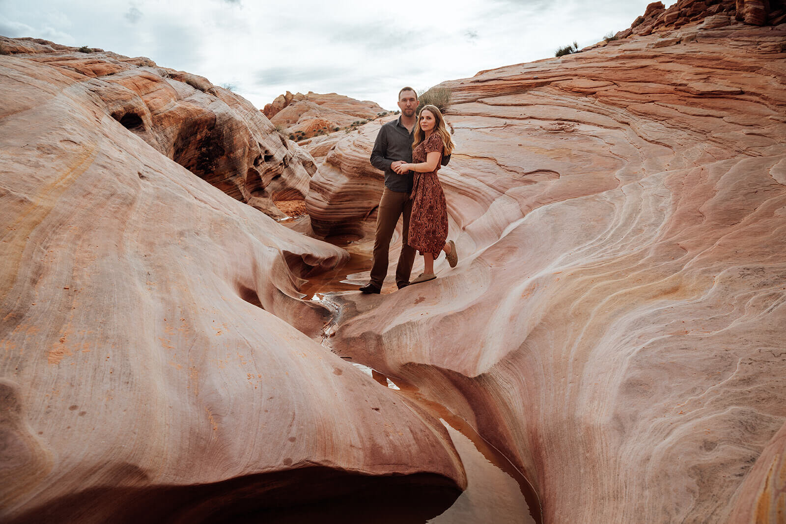  Couple snuggles in Valley of Fire State Park next to Lake Mead, outside of Las Vegas, Nevada. Las Vegas wedding photographer 