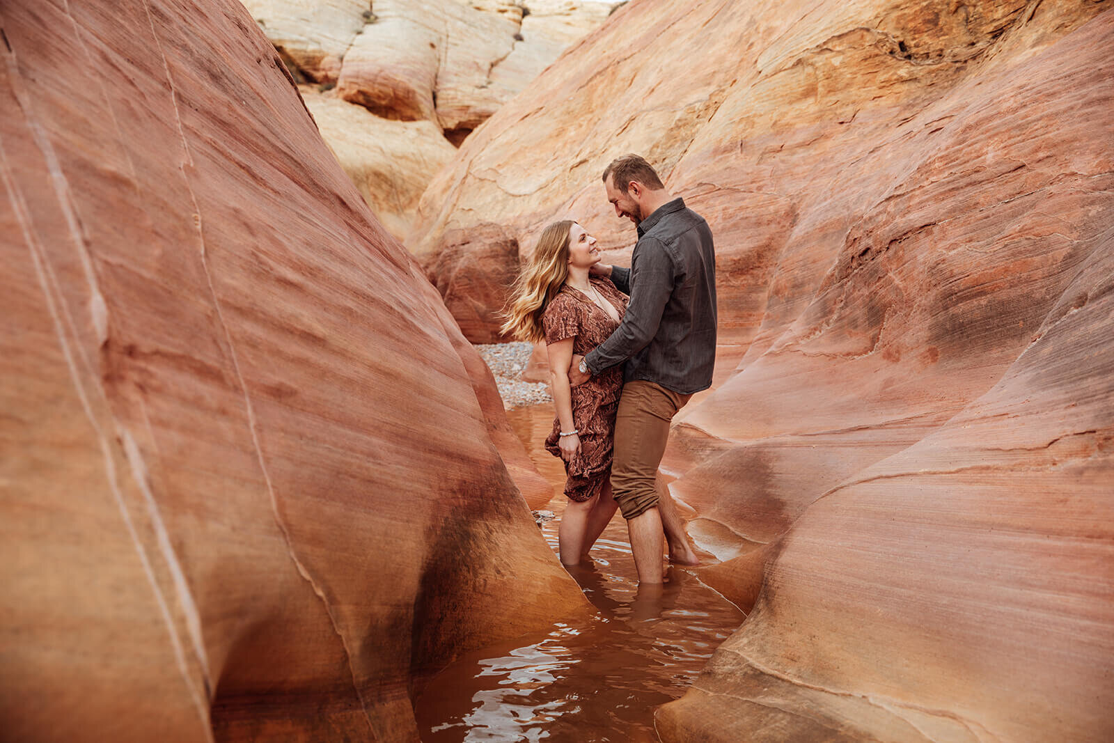  Couple snuggles in Valley of Fire State Park next to Lake Mead, outside of Las Vegas, Nevada. Nevada wedding photographer 