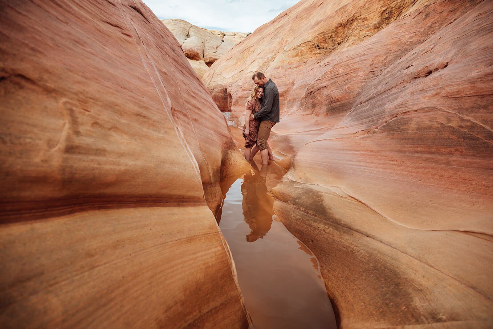  Couple snuggles in Valley of Fire State Park next to Lake Mead, outside of Las Vegas, Nevada. Nevada wedding photographer 