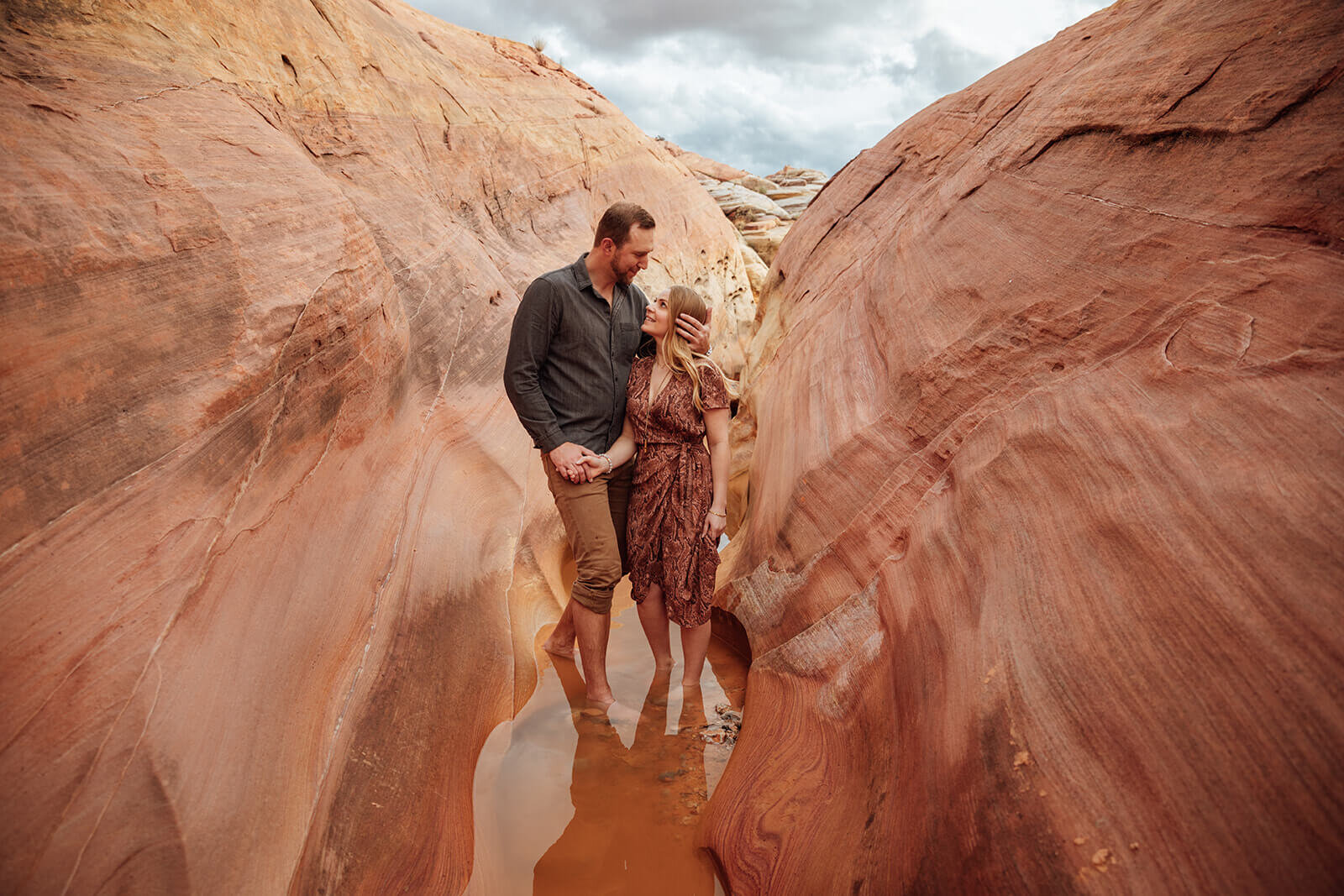  Couple snuggles in Valley of Fire State Park next to Lake Mead, outside of Las Vegas, Nevada. Nevada wedding photographer 