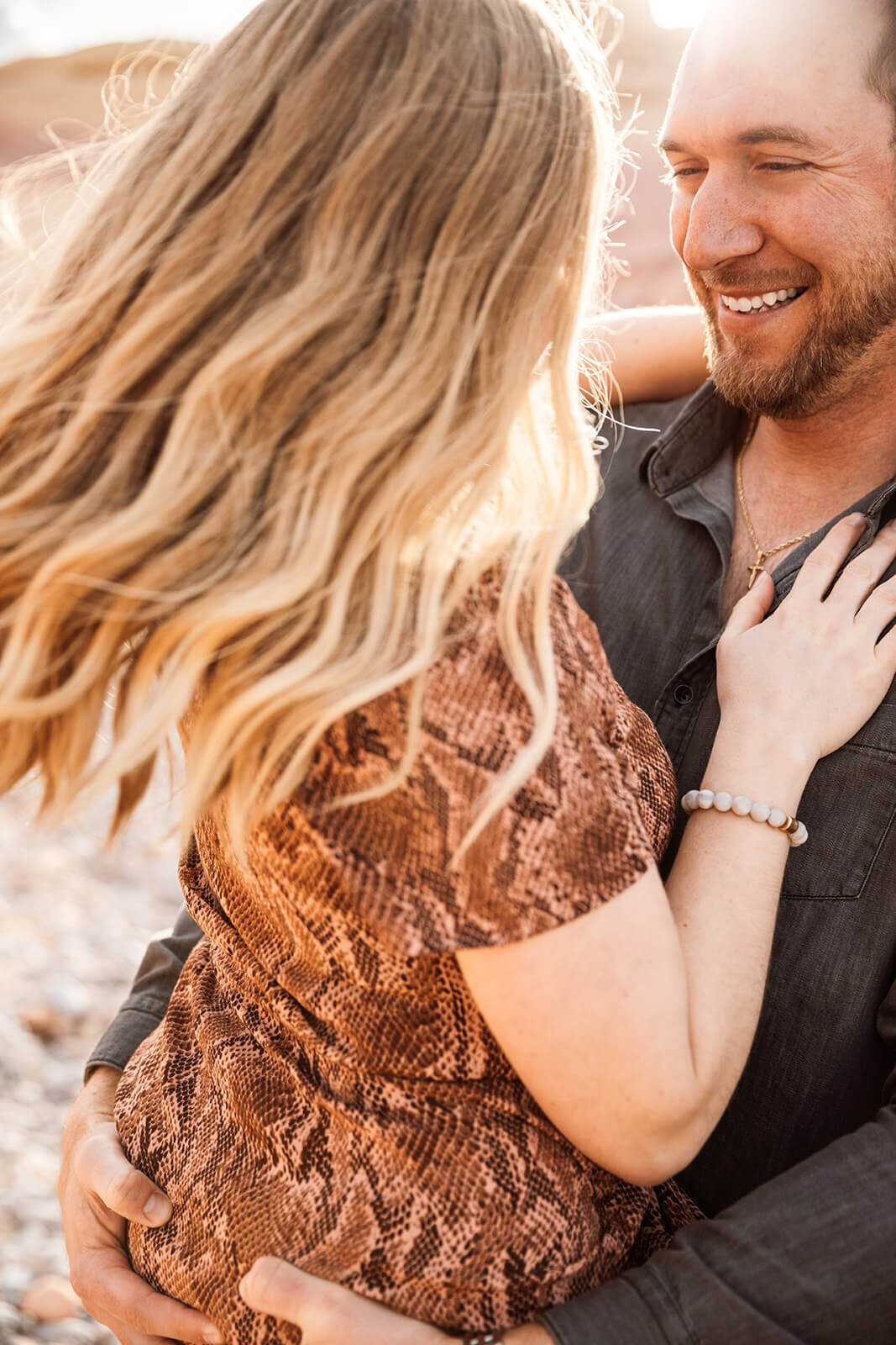  Couple plays in Valley of Fire State Park next to Lake Mead, outside of Las Vegas, Nevada. Nevada engagement photographer 