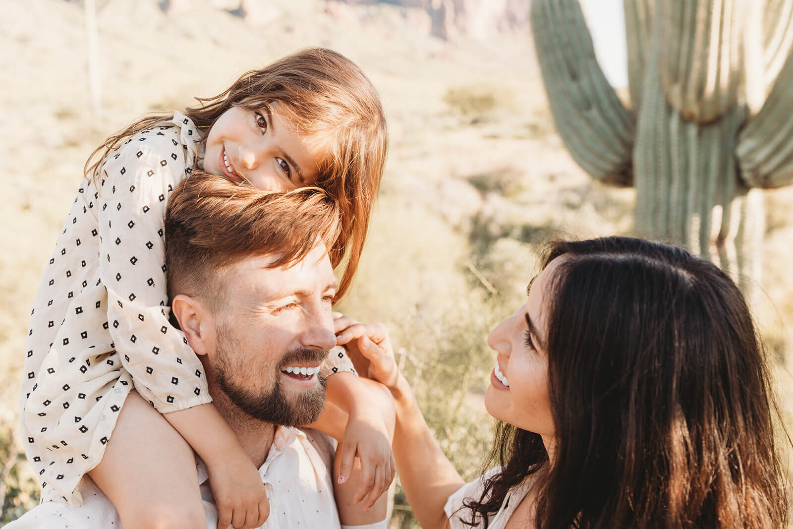  Couple includes their daughter in engagement session in the Superstition Mountains outside of Phoenix, Arizona. Arizona elopement photographer 