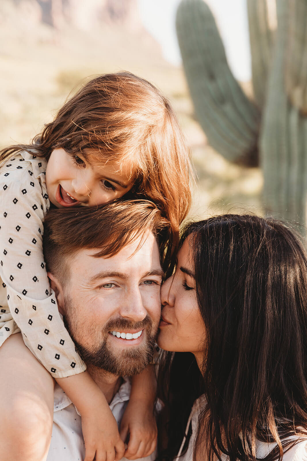  Couple includes their daughter in engagement session in the Superstition Mountains outside of Phoenix, Arizona. Arizona elopement photographer 