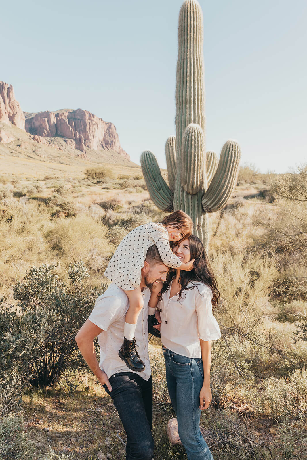  Couple includes their daughter in engagement session in the Superstition Mountains outside of Phoenix, Arizona. Arizona elopement photographer 