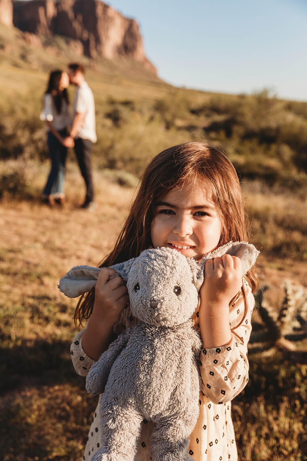  Couple includes their daughter in engagement session in the Superstition Mountains outside of Phoenix, Arizona. Arizona elopement photographer 