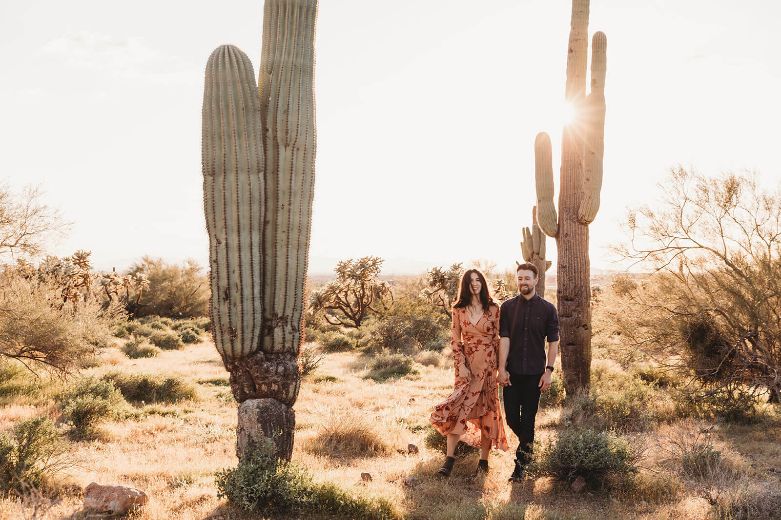  Couple hikes through desert wonderland during their engagement session in the Superstition Mountains outside of Phoenix, Arizona. Arizona engagament photographer 