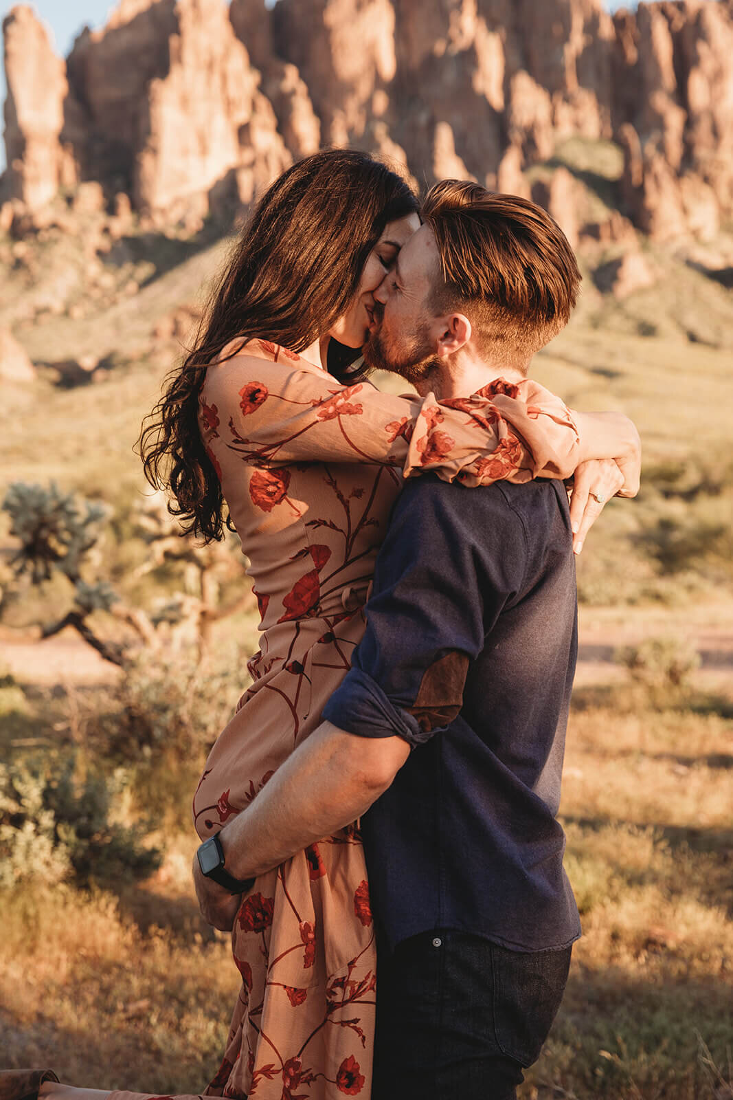  Couple kisses during their engagement session in the Superstition Mountains outside of Phoenix, Arizona. Arizona engagament photographer 