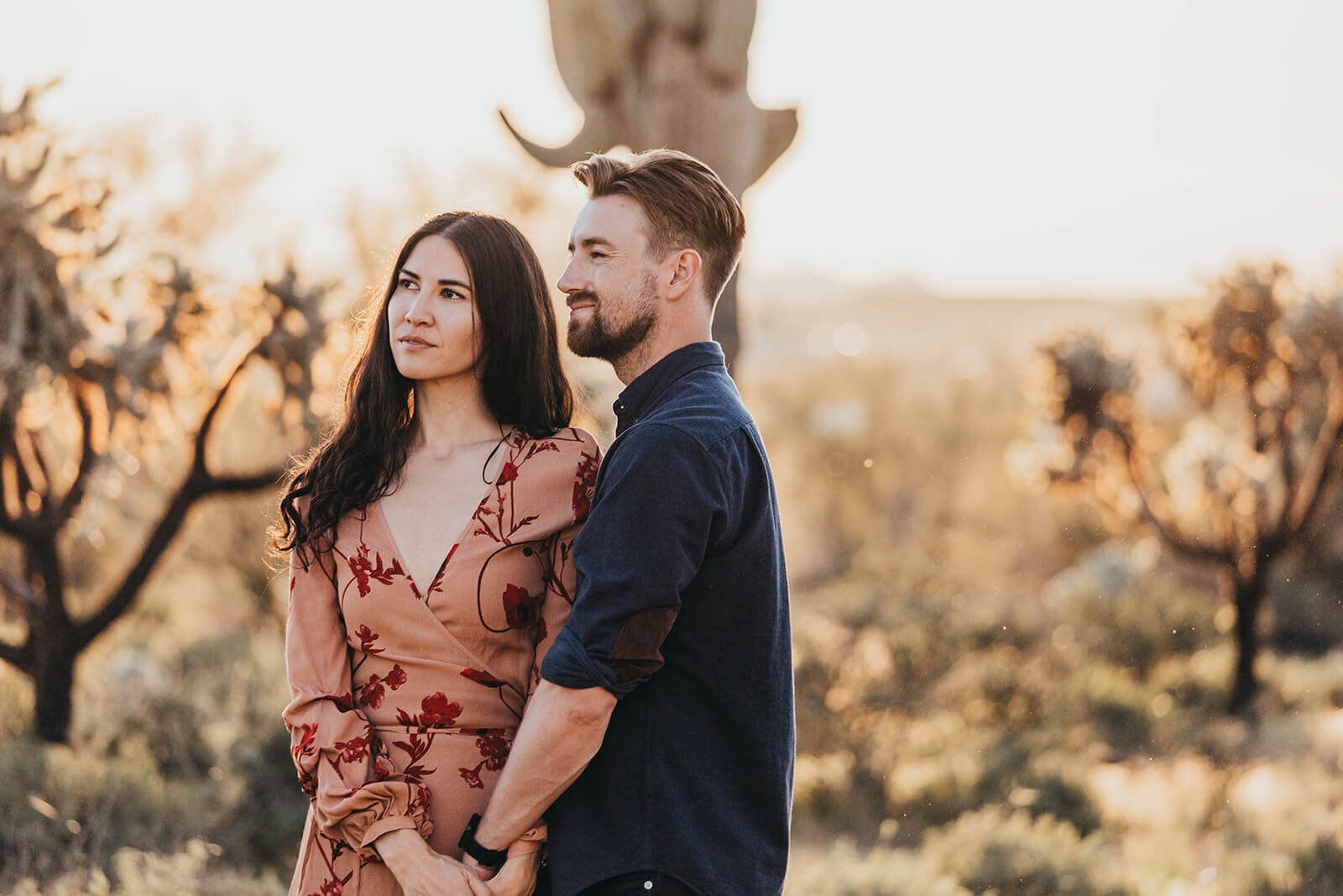  Couple hikes through desert wonderland during their engagement session in the Superstition Mountains outside of Phoenix, Arizona. Arizona wedding photographer 