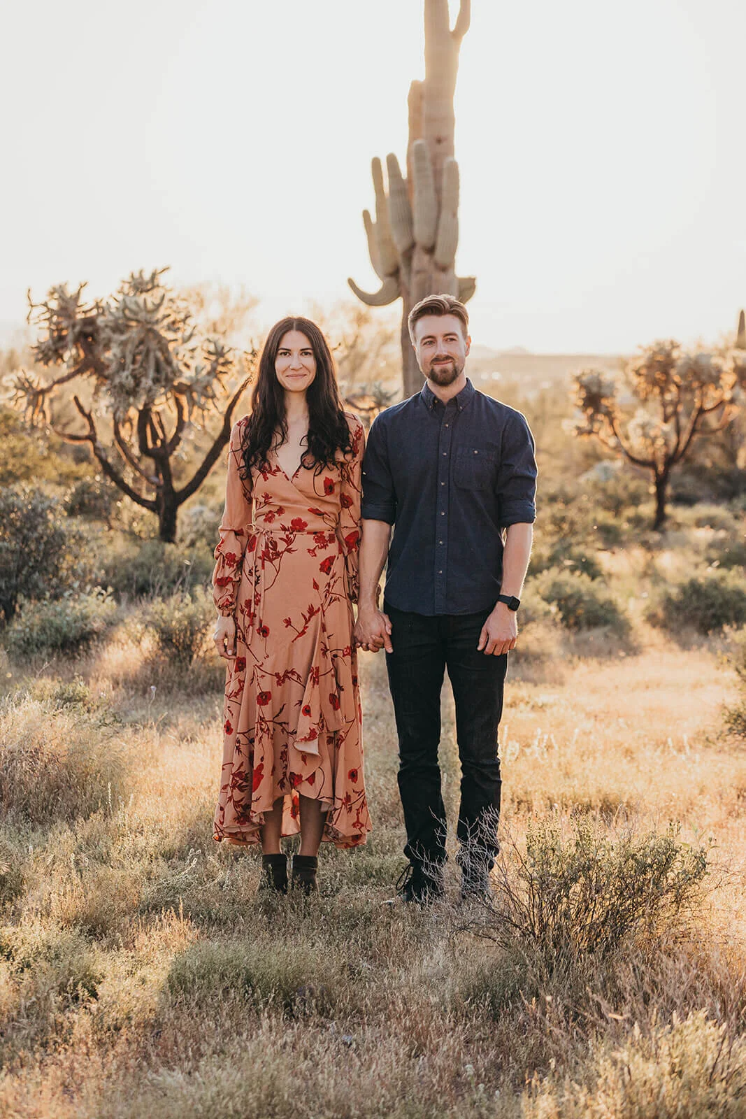 Couple hikes through desert wonderland during their engagement session in the Superstition Mountains outside of Phoenix, Arizona. Arizona wedding photographer