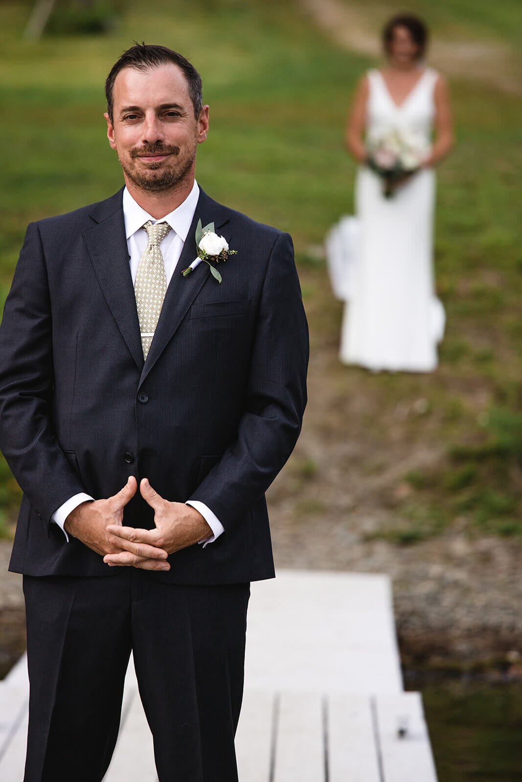  Groom waiting for bride during first look. Small outdoor wedding in Maine. 