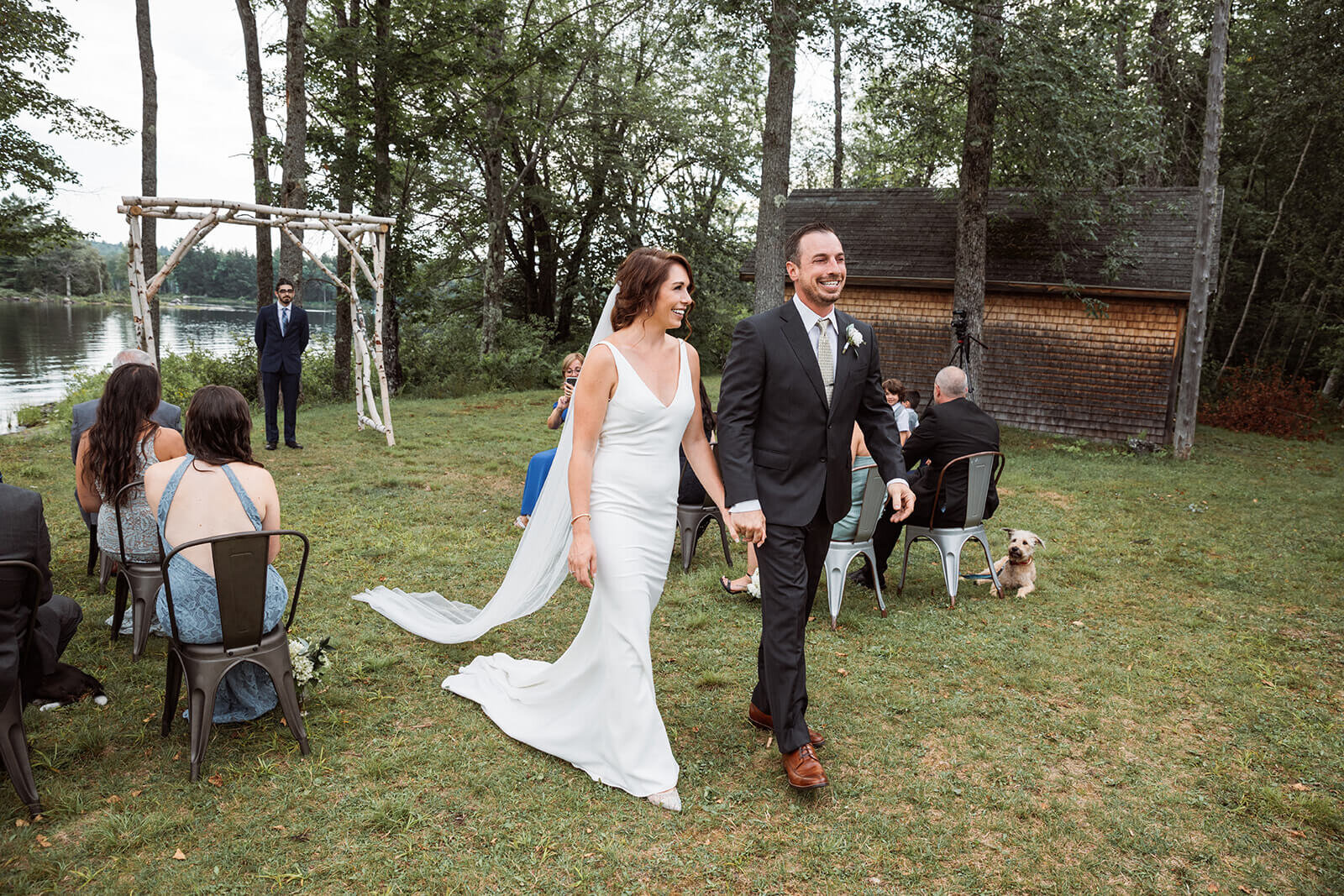  Recessional during a small outdoor wedding on a lake in Maine. 