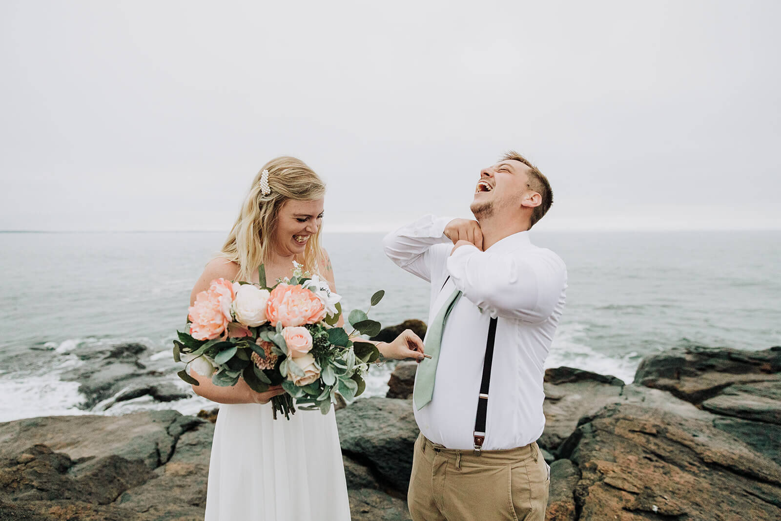  A couple explores during their elopement on the Rhode Island Coast in Narragansett. 