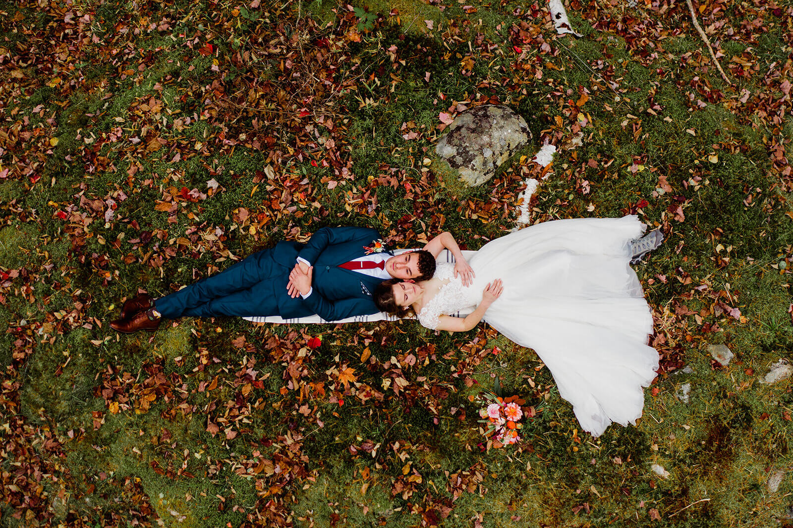  Bride and groom relax during elopement in the White Mountains in New Hampshire. New Hampshire elopement packages. 