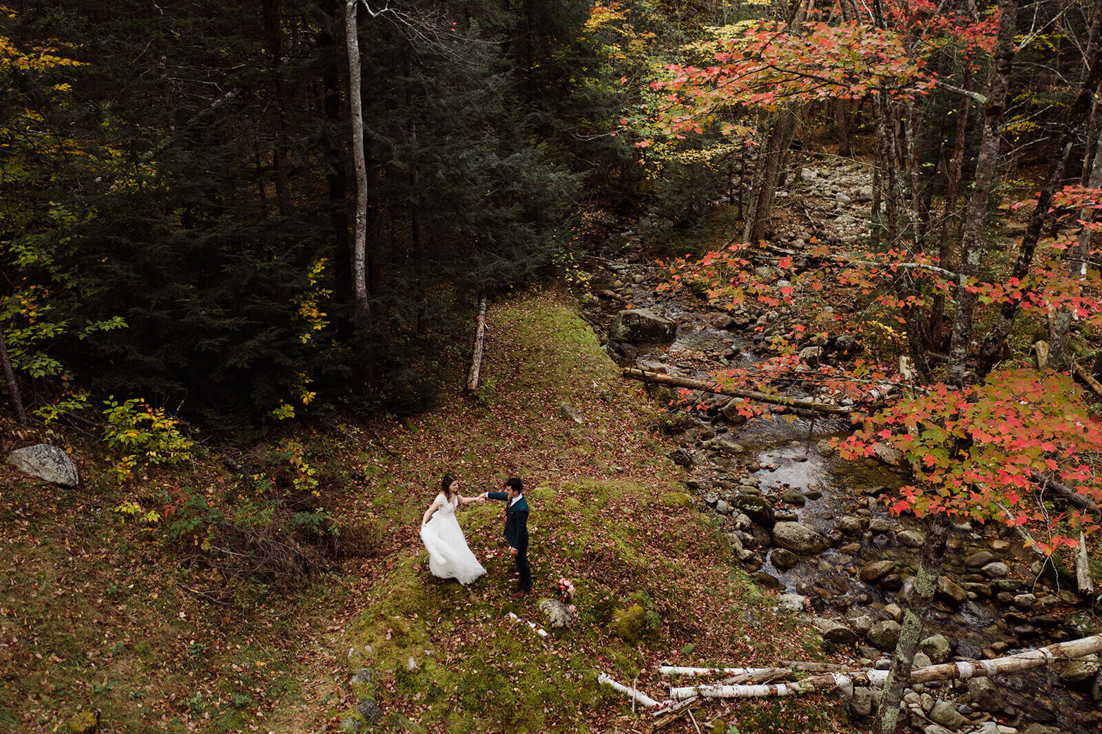  Bride and groom dance during elopement in the White Mountains in New Hampshire. New Hampshire elopement packages. 