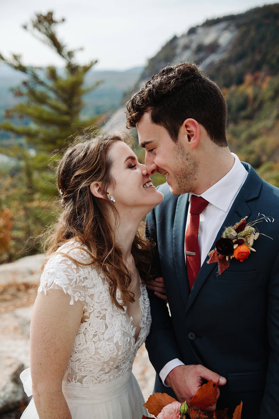  The couple steals a quiet moment after their elopement ceremony to take in the view and each other in the White Mountains in New Hampshire. New Hampshire elopement 