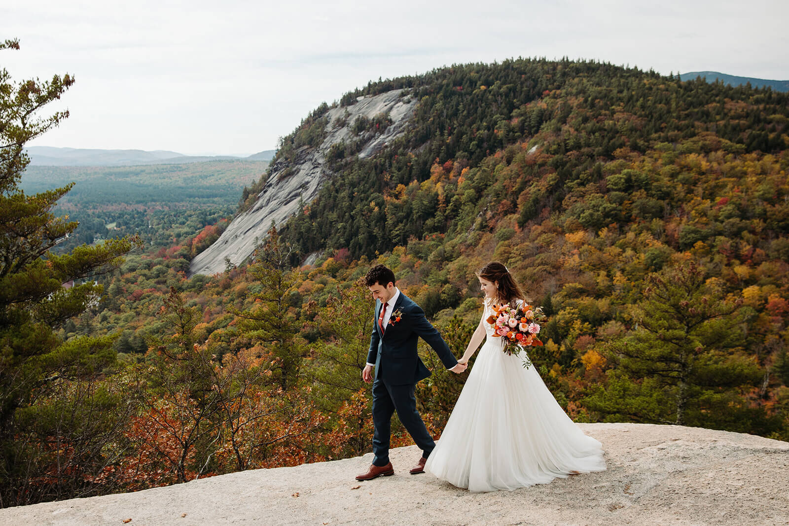  The couple steals a quiet moment after their elopement ceremony to take in the view and each other in the White Mountains in New Hampshire. New Hampshire elopement 