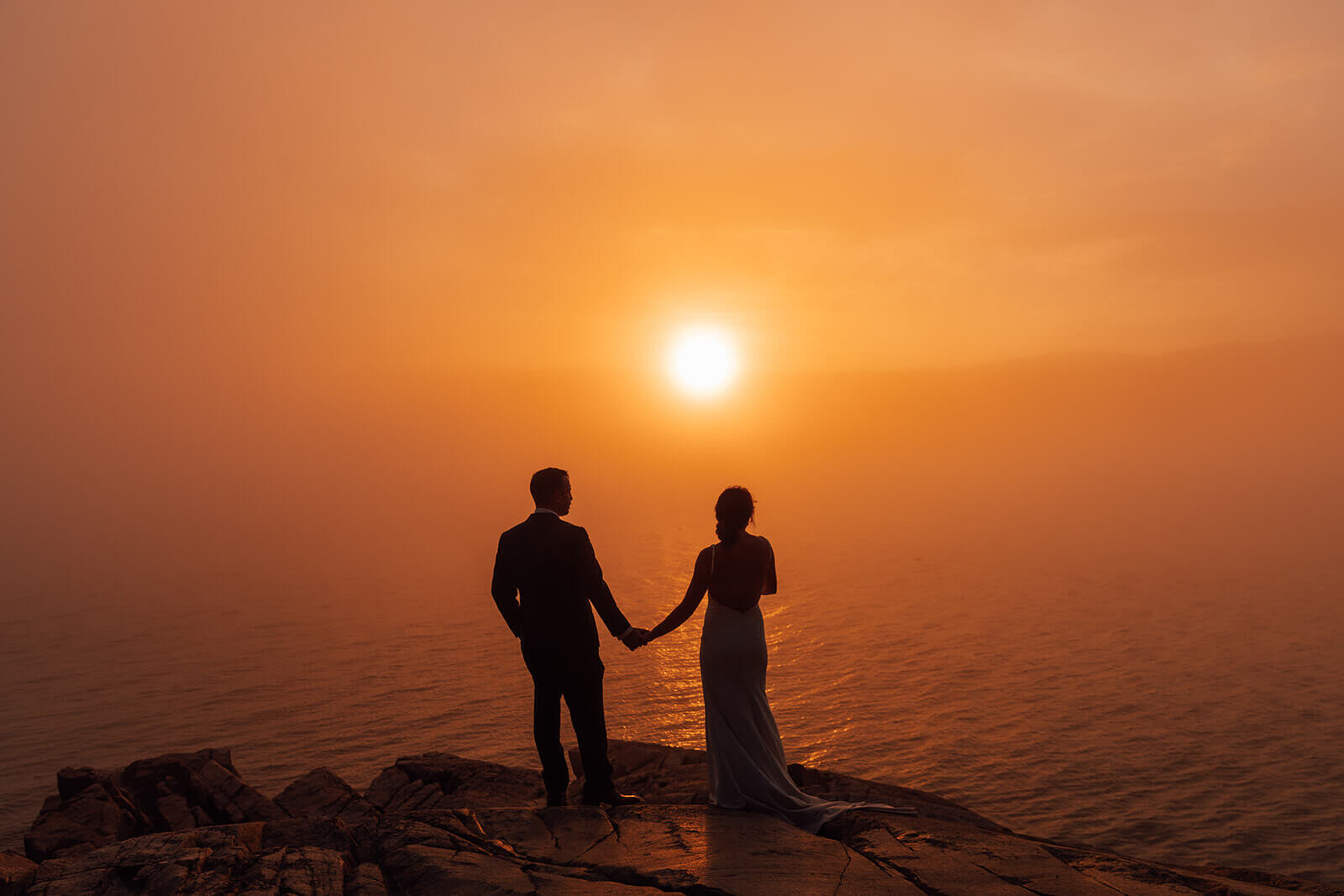  Sunset during a couple’s elopement on the coast in Acadia National Park, Maine. 