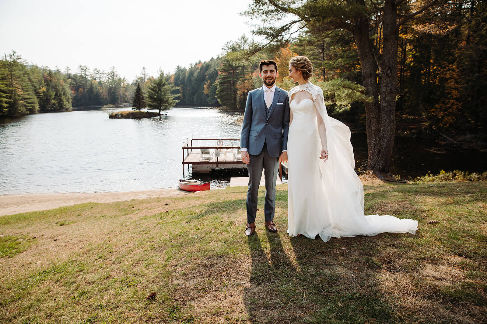  First look between the couple at their lake lodge during their small outdoor wedding in the Adirondacks in Upstate NY.  Upstate NY small wedding venues. Upstate New York wedding packages. 