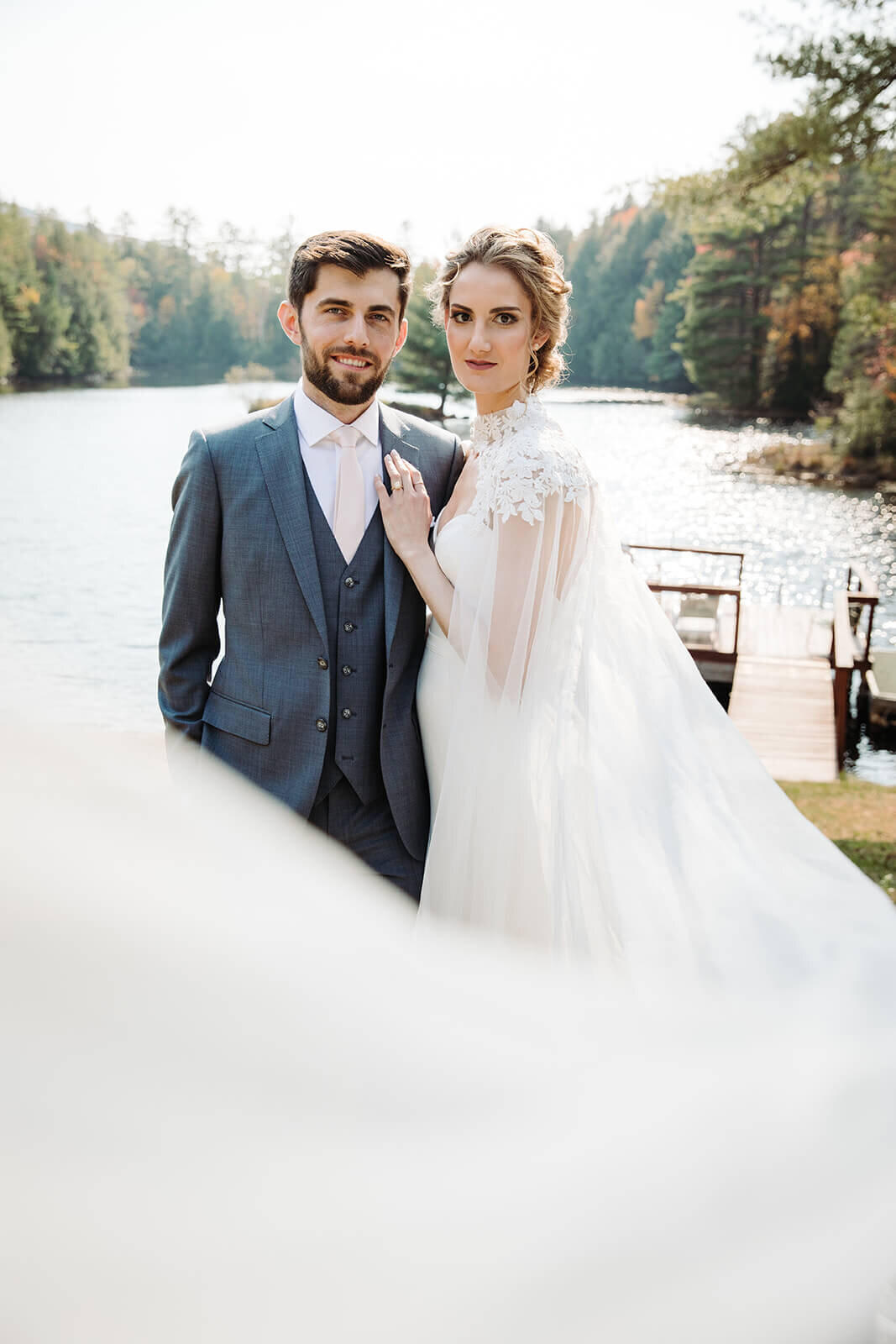  First look between the couple at their lake lodge during their small outdoor wedding in the Adirondacks in Upstate NY.  Upstate NY small wedding venues. Upstate New York wedding packages. 