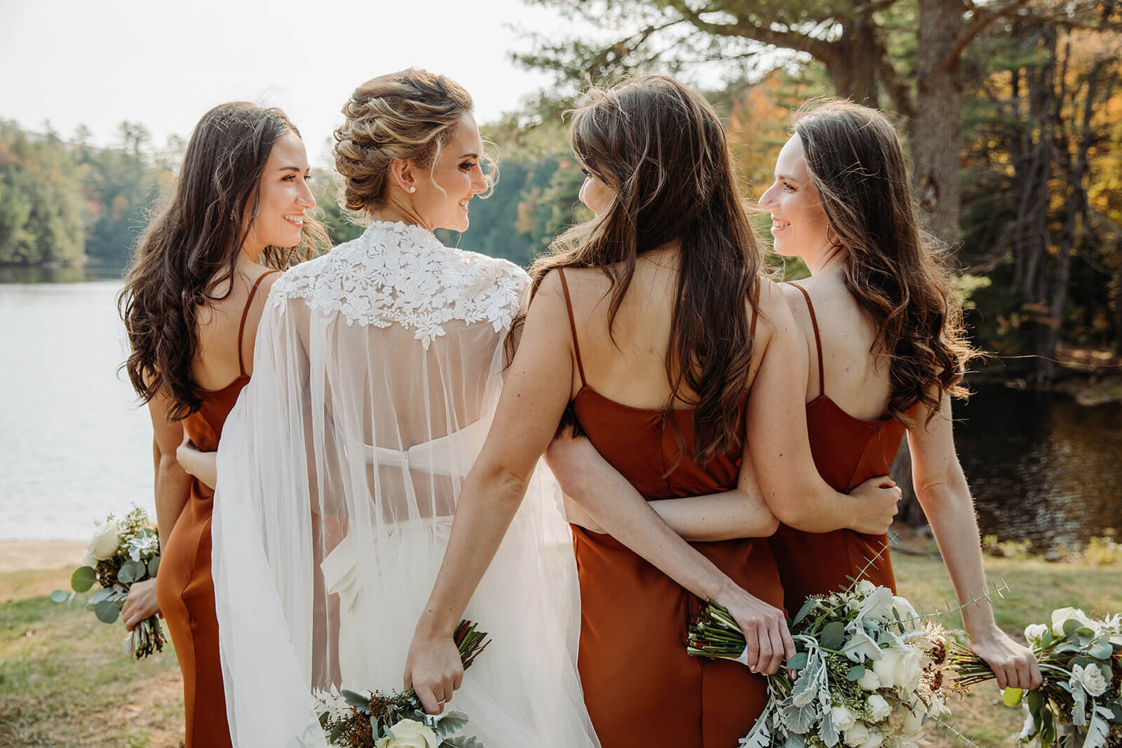  Bride and her sisters pose for formal portraits during her small outdoor wedding in the Adirondacks in Upstate NY. 