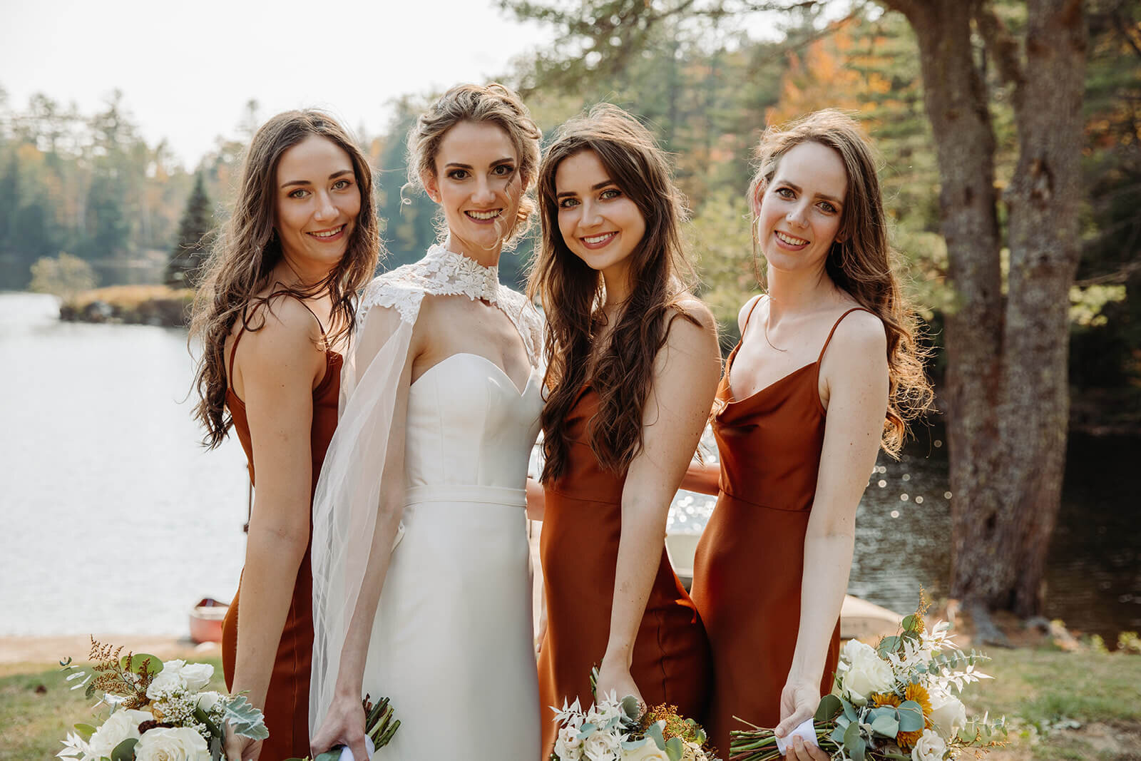  Bride and her sisters pose for formal portraits during her small outdoor wedding in the Adirondacks in Upstate NY. 