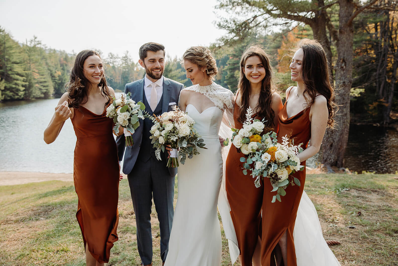  The couple and the bride’s sisters pose for formal portraits during her small outdoor wedding in the Adirondacks in Upstate NY. 