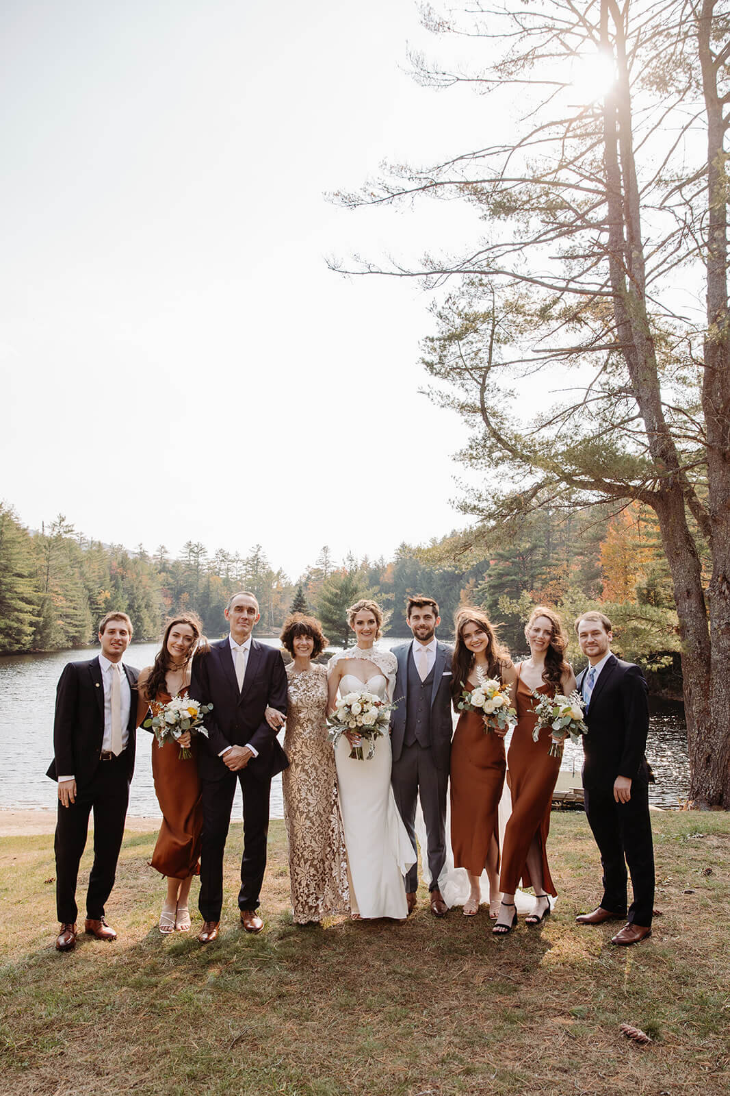  Formal family portrait at beautiful lake lodge in the Adirondacks in Upstate New York. 