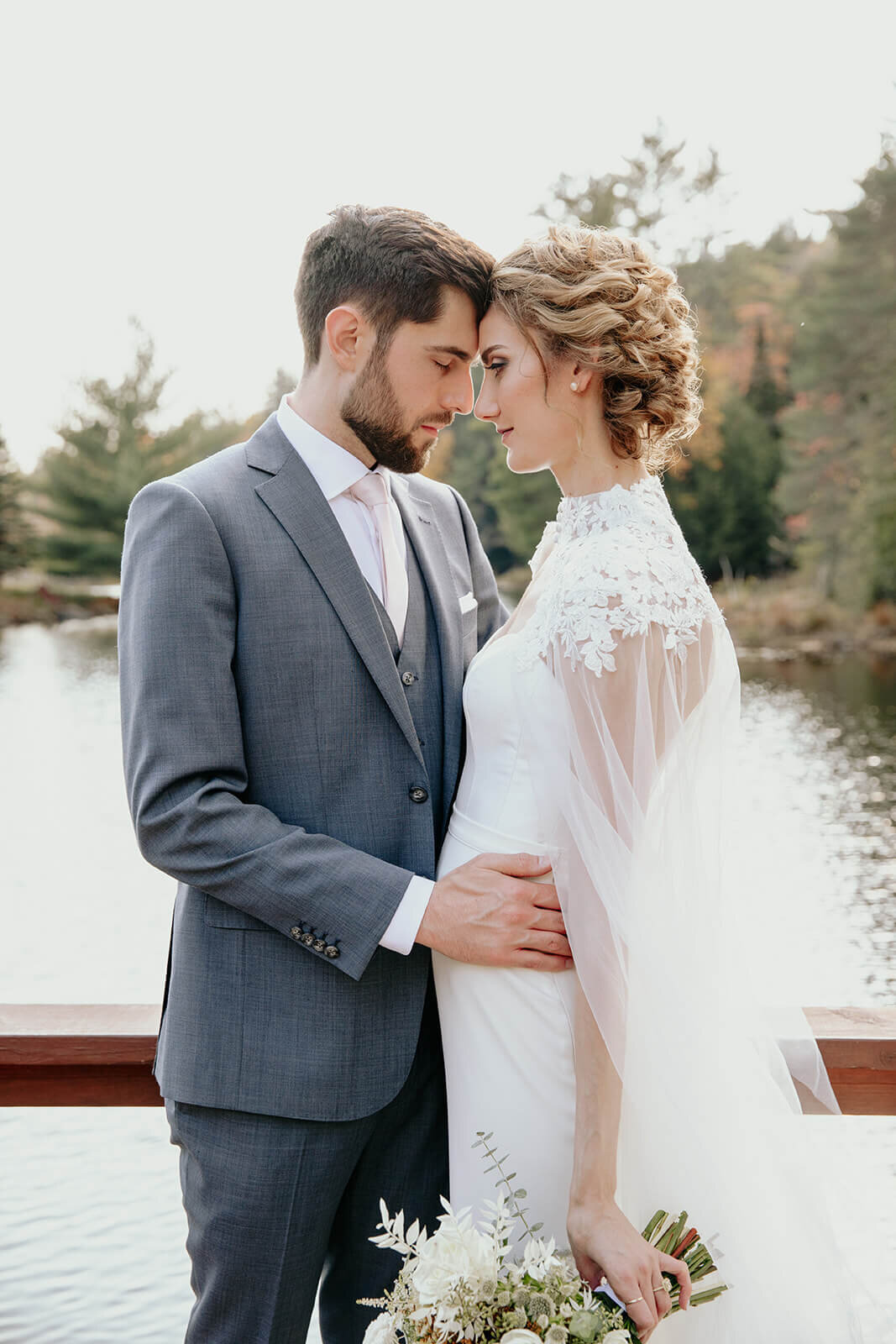  Bride and groom enjoy a moment alone during their fall wedding in the Adirondacks in Upstate New York. 