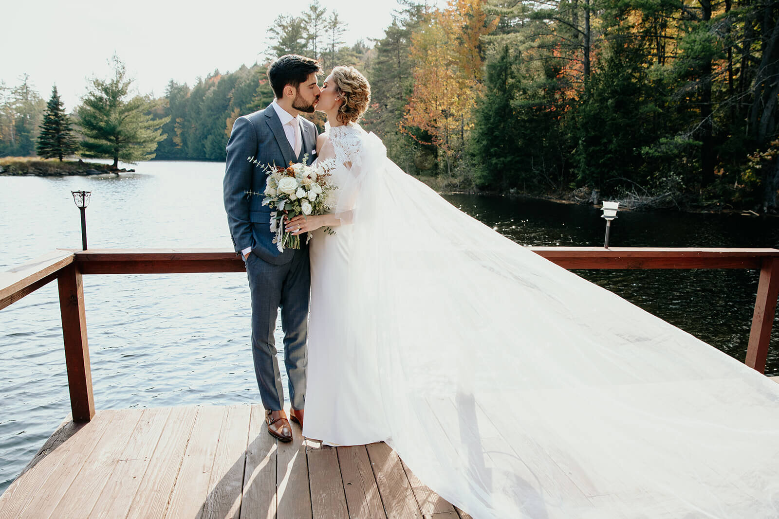  Bride and groom enjoy a moment alone during their fall wedding in the Adirondacks in Upstate New York. 