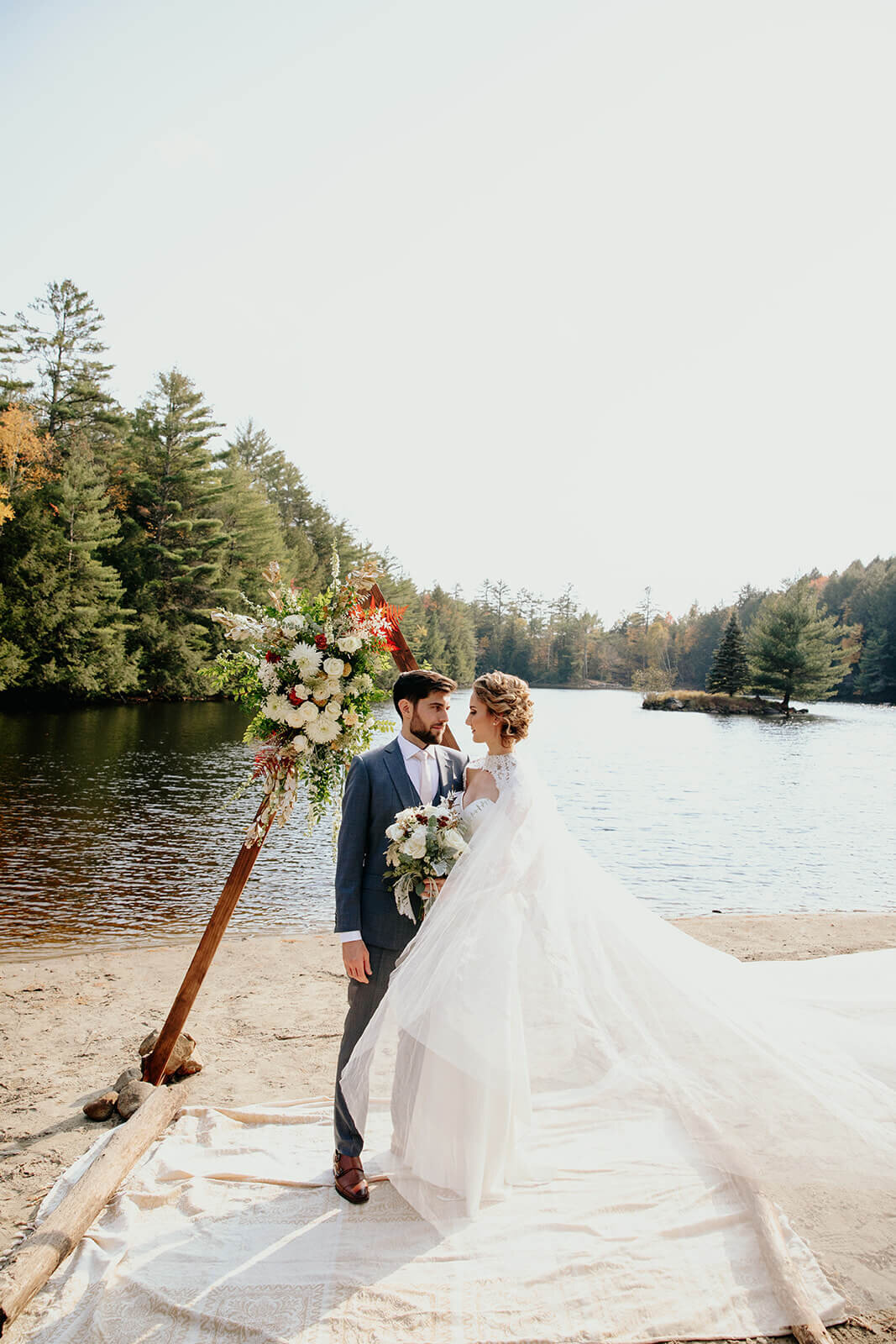  Bride and groom enjoy a moment alone during their fall wedding in the Adirondacks in Upstate New York. 