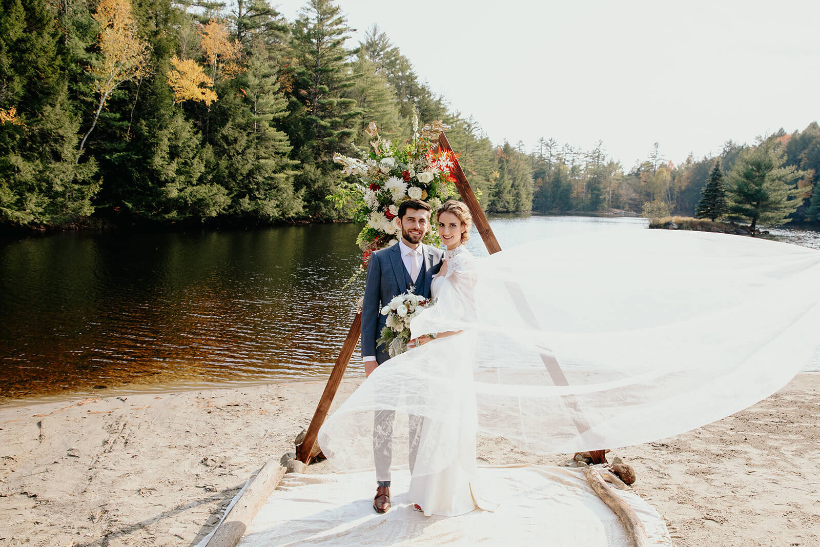  Bride and groom enjoy a moment alone during their fall wedding in the Adirondacks in Upstate New York. 