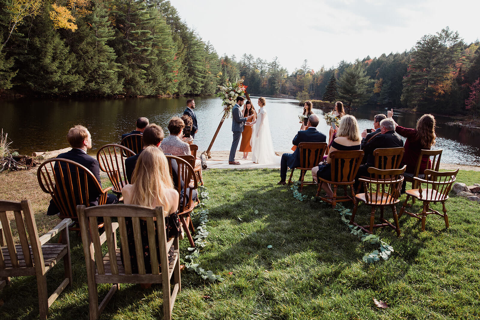  Small outdoor wedding on lake beach during the fall in the Adirondacks in Upstate New York. New York wedding packages. Upstate NY elopement packages. 