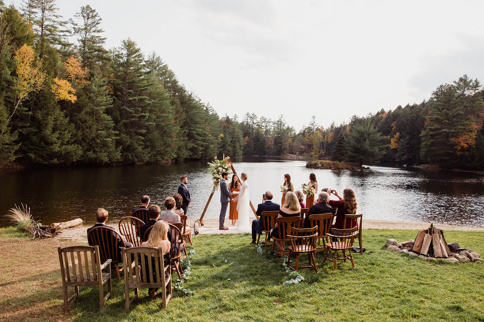  Small outdoor wedding on lake beach during the fall in the Adirondacks in Upstate New York. New York wedding packages. Upstate NY elopement packages. 