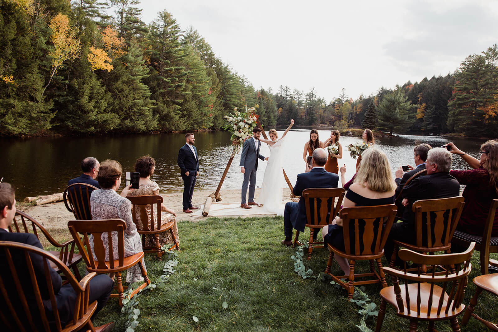  Small outdoor wedding on lake beach during the fall in the Adirondacks in Upstate New York. New York wedding packages. Upstate NY elopement packages. 