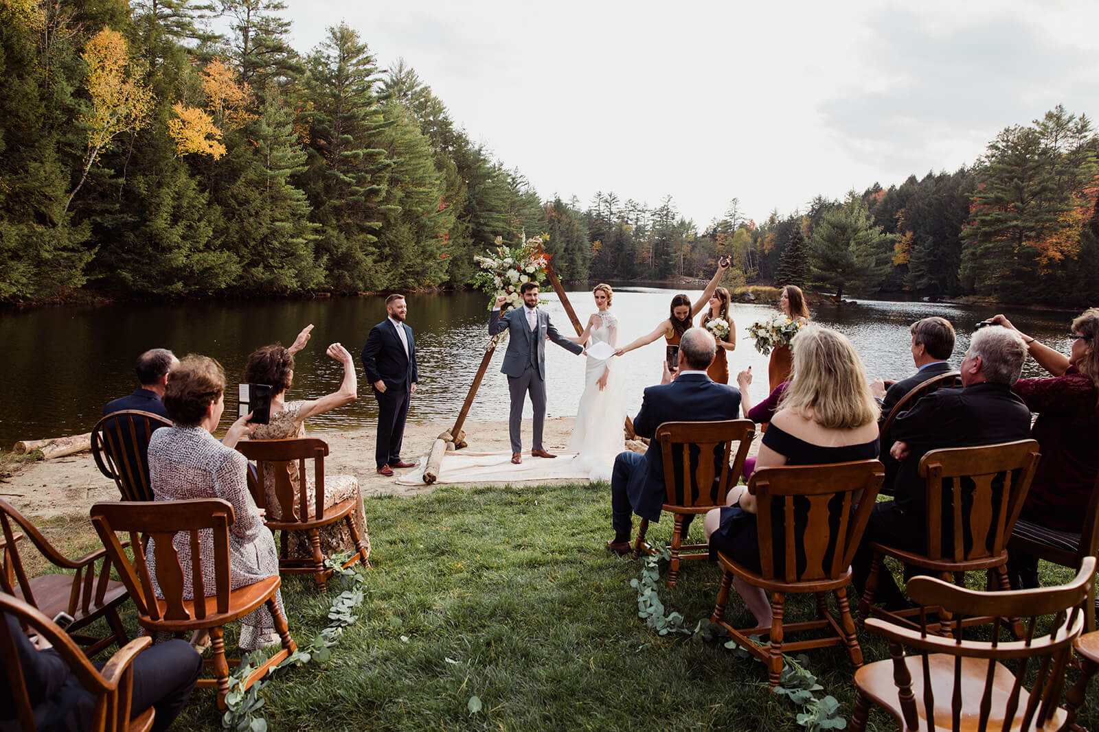  Small outdoor wedding on lake beach during the fall in the Adirondacks in Upstate New York. New York wedding packages. Upstate NY elopement packages. 